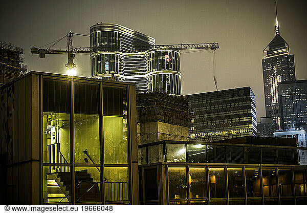 Thick cluster of apartment and commercial buildings in a dense city.