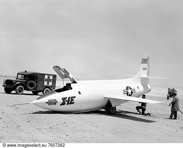 This photo was taken June 18  1956 on Rogers Dry Lake bed after Flight 7 of the Bell Aircraft Corporation X_1E with NACA High_Speed Flight Station test pilot Joseph Joe Walker at the controls. The first generation X_1s were well known for nose gear failures and the X_1E was no exception. The hard pitch down on landing usually resulted in a collapsed nose gear. The damage rarely was serious but required several days of down_time for repair.