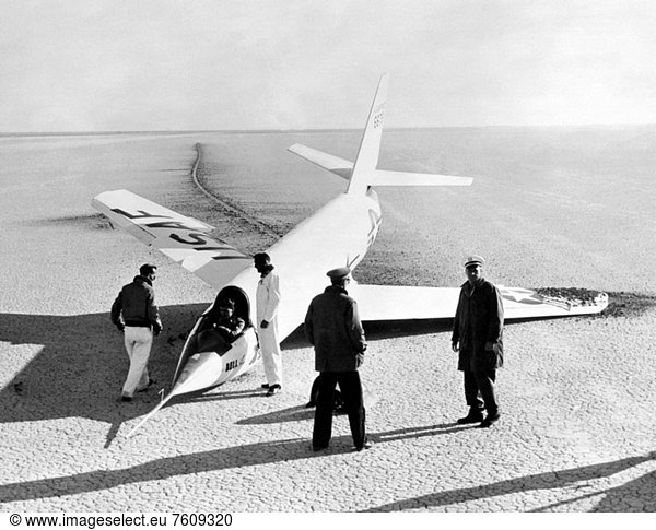 This 1952 photograph shows the X_2 2 46_675 with a collapsed nose landing gear  after landing on the first glide flight at Edwards Air Force Base. The aircraft pitched at landing  slid along its main skid  and contacted the ground with the right wingtip bumper skid  causing it to break off. The nose wheel had collapsed upon contacting the ground. In the photo  Bell test pilot Jean Ziegler is still in the cockpit as ground crewmen stand by the aircraft. The X_2 2 was subsequently destroyed in an explosion during captive flight on May 12  1953  killing Ziegler and EB_50A crewmember Frank Wolko.