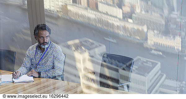 Thoughtful businessman working in conference room