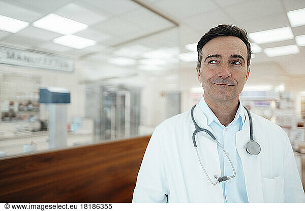 Thoughtful mature doctor with stethoscope