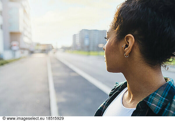 Thoughtful young woman on road