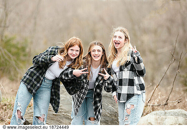 Three beautiful teen girls having fun outdoors.