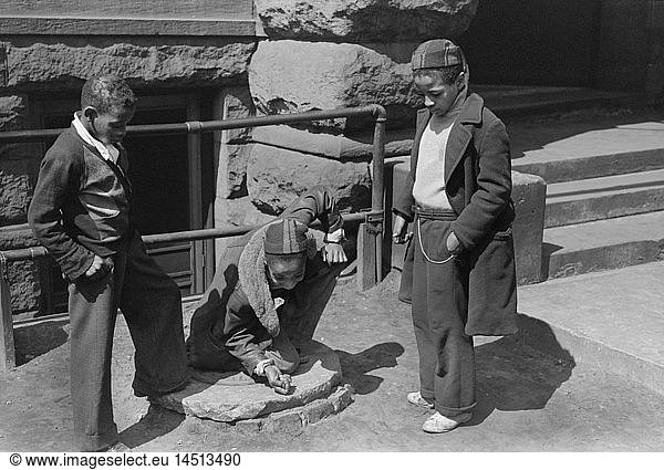 Three Boys Playing Marbles  South Side  Chicago  Illinois  USA  Russell Lee  Farm Security Administration  April 1941