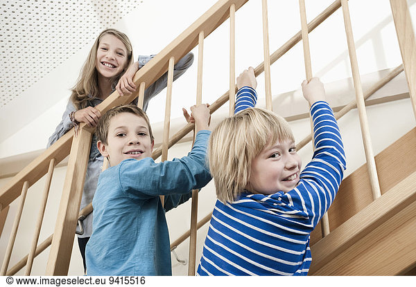 Three children at staircase
