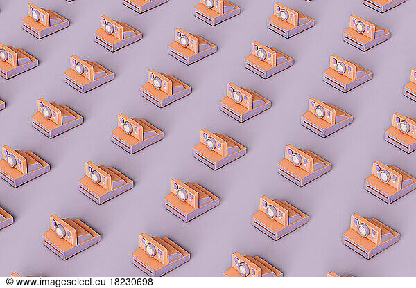 Three dimensional pattern of rows of instant cameras flat laid against purple background