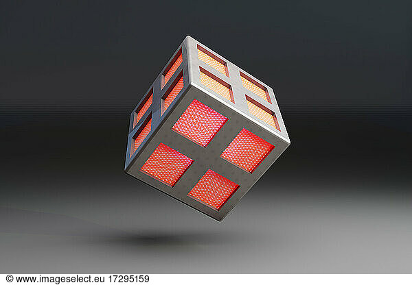 Three dimensional render of cube shaped network node floating against black background
