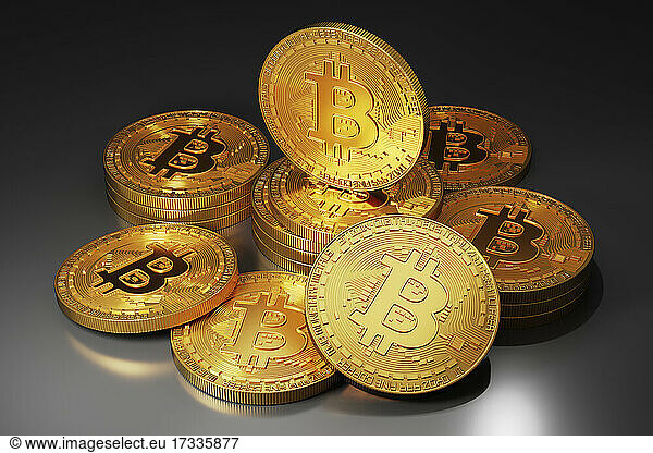 Three dimensional render of golden Bitcoins