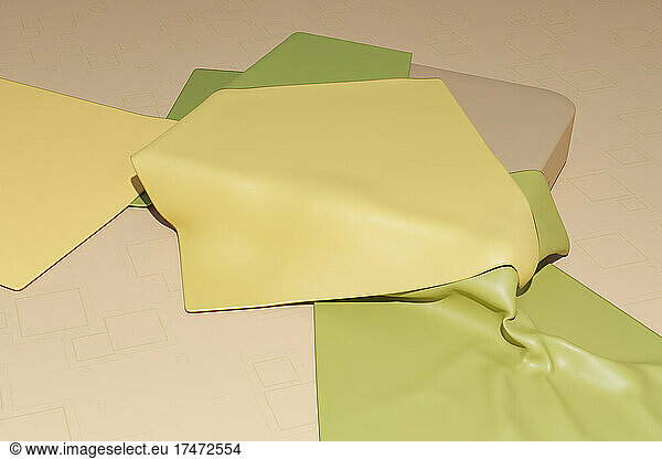 Three dimensional render of green and yellow fabric swatches against beige background