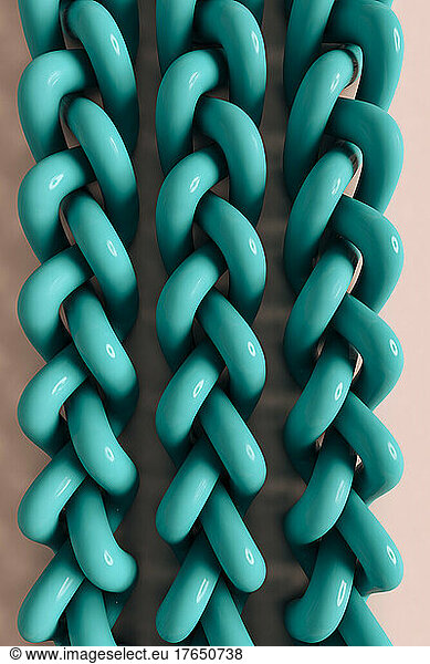 Three dimensional render of green metallic ropes