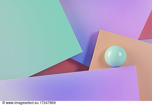 Three dimensional render of green sphere balancing against pastel colored rectangles