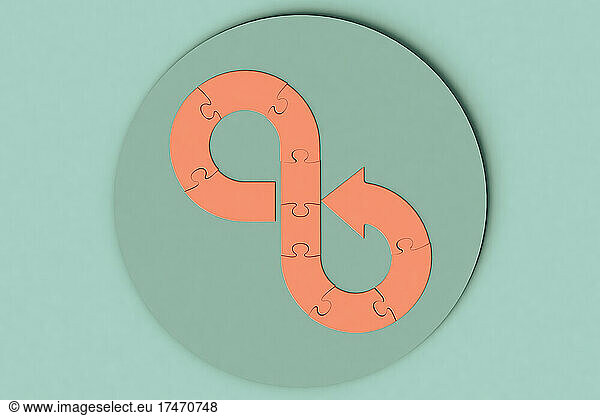 Three dimensional render of infinity symbol made of blank jigsaw pieces