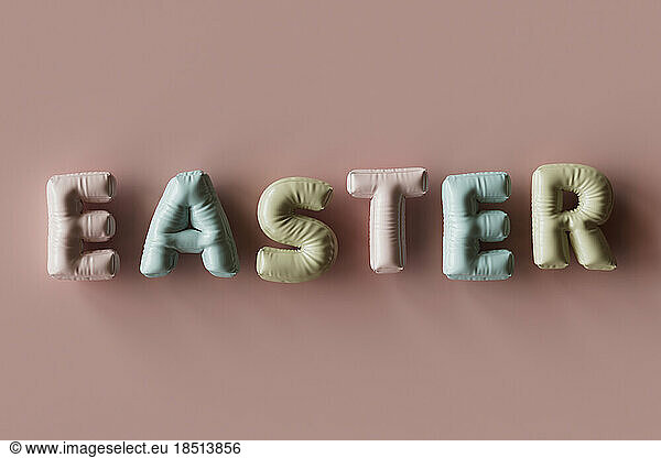Three dimensional render of inflatable letters spelling word Easter