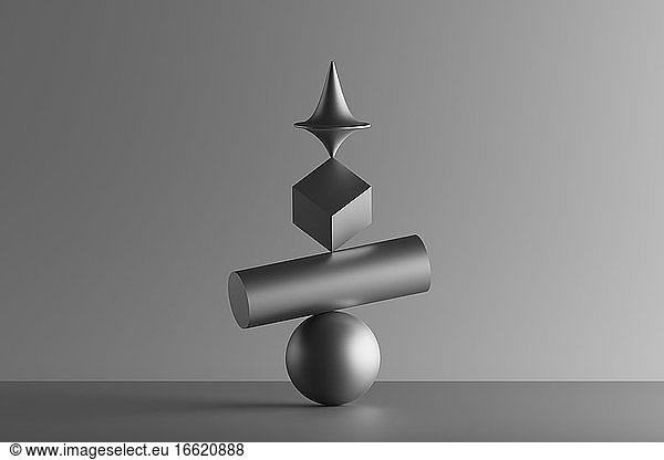 Three dimensional render of metallic top spinning on top of geometric cube  cylinder and sphere
