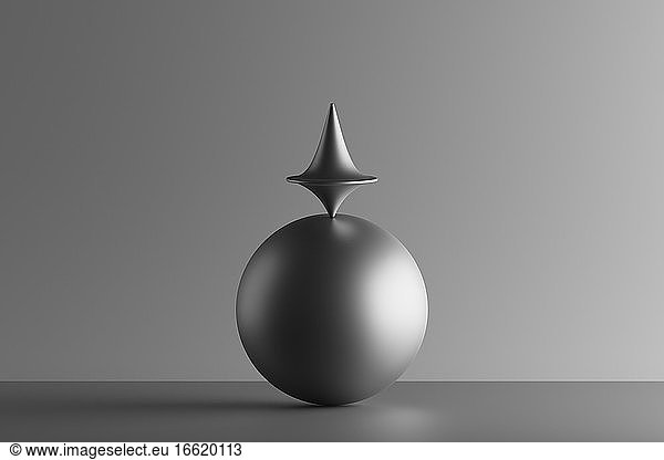 Three dimensional render of metallic top spinning on top of sphere