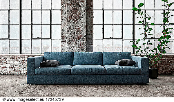 Three dimensional render of modern sofa standing in front of windows inside industrial loft