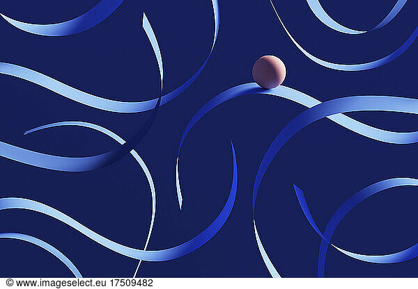 Three dimensional render of orange sphere rolling down blue ribbons