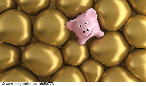 Three dimensional render of piggy bank surrounded by gold bubbles