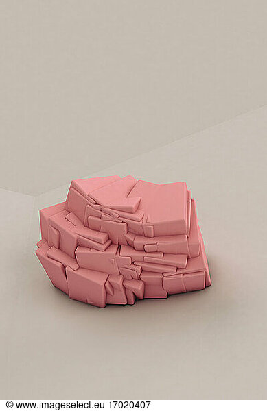 Three dimensional render of pink cuboids attached together