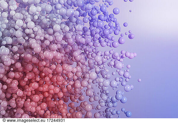 Three dimensional render of purple spheres floating against purple background