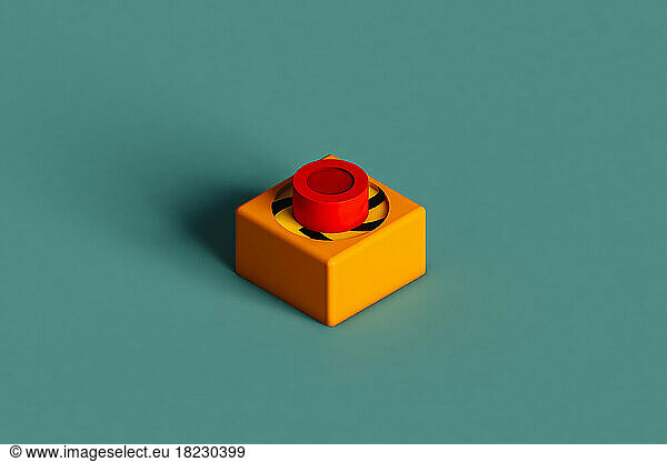 Three dimensional render of push button lying against green background