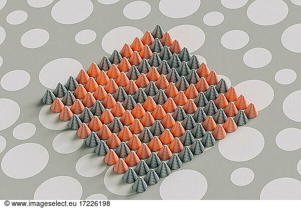 Three dimensional render of red and gray cones laid on polka dot pattern