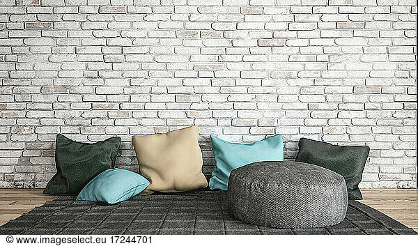 Three dimensional render of relaxation area consisting of rug and cushions placed in front of brick wall