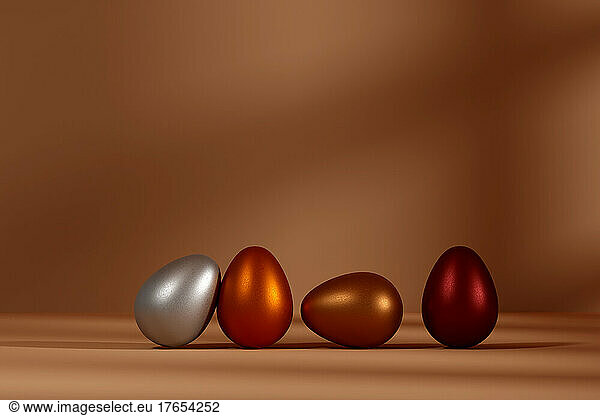 Three dimensional render of row of metallic eggs