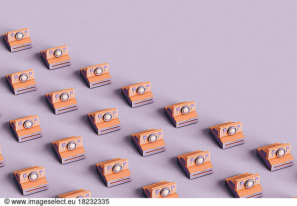 Three dimensional render of rows of instant cameras flat laid against purple background