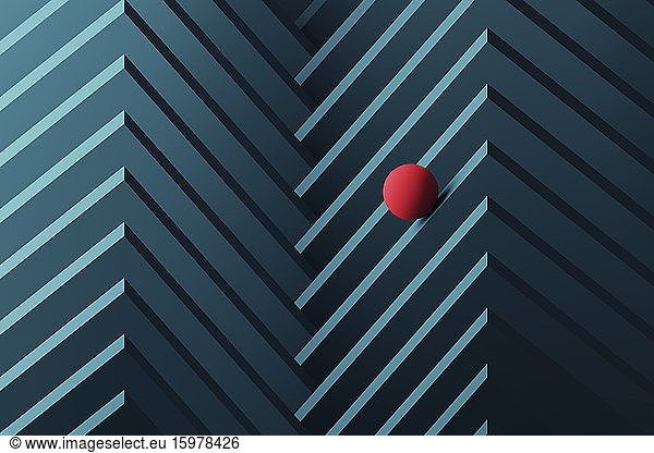 Three dimensional render of small red sphere rolling over geometric pattern