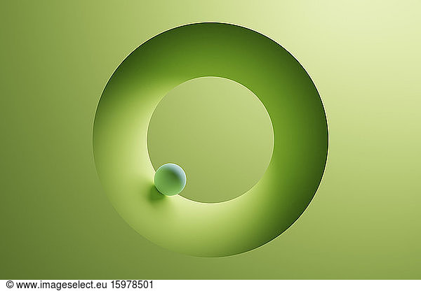 Three dimensional render of small sphere inside green ring