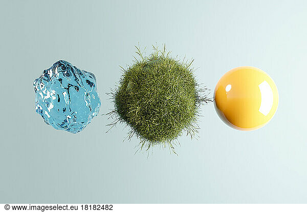 Three dimensional render of three spheres representing water  grass and sun