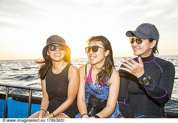 three female friends on a boat trip at Tubbataha reef