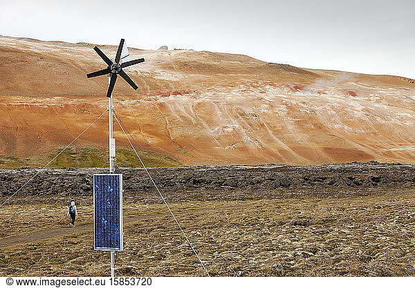 Three forms of renewable energy on one site  wind power  solar power and geothermal at a fresh lava flow that erupted during the Krafla fires at Leirhnjukur near Myvatn  Iceland during the 19