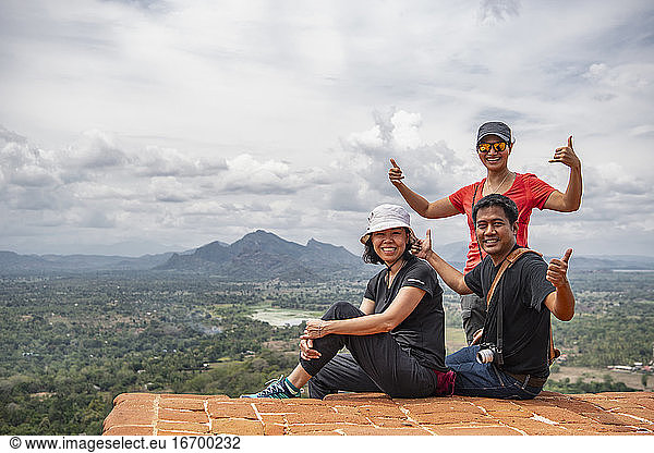 three friends on top of the rock fortress of Sigiriya