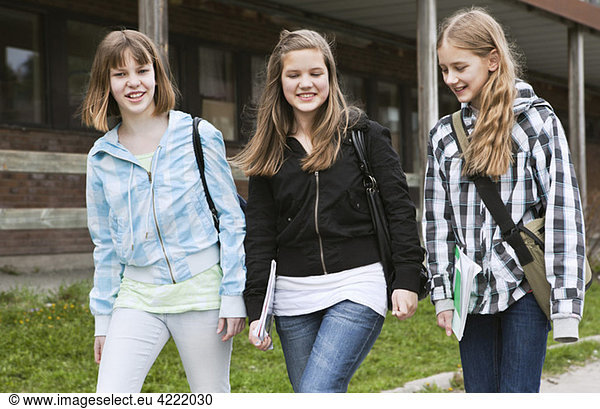 Three girls walking