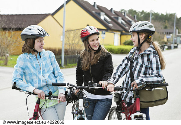 Three girls with bikehelmet 2