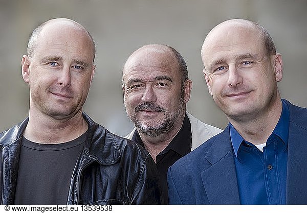Three men with bald heads