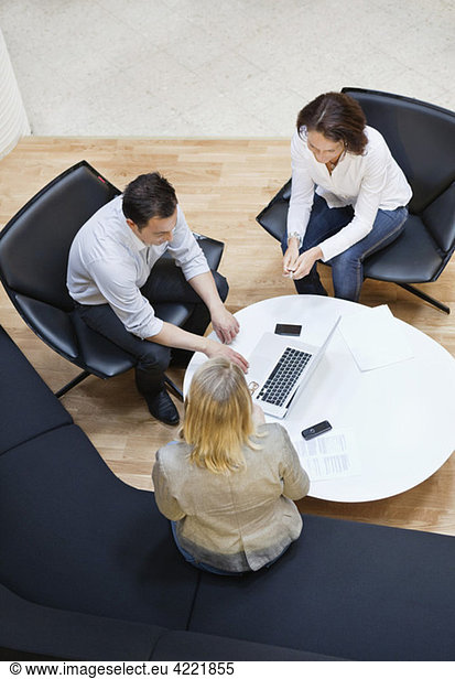 Three people at meeting from above