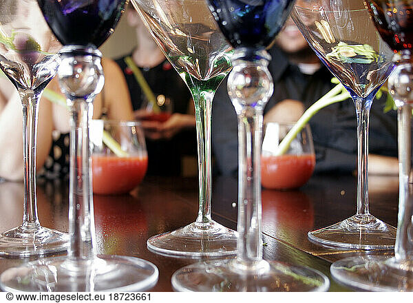 Three people have wine and hang out at the bar  Nashville  Tennessee.