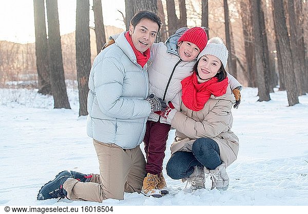 Three playing in the snow