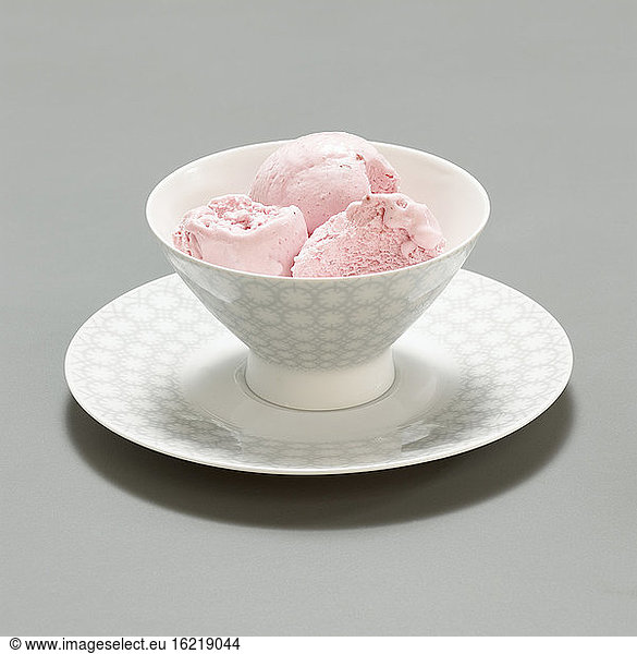 Three scoops of strawberry ice cream  close-up