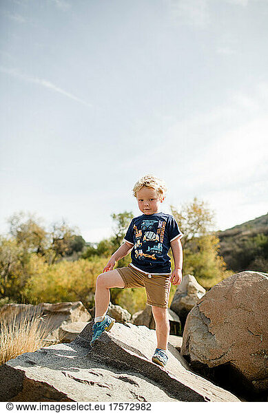 Three Year Old Boy Posing on Rock at Mission Trails in San Diego