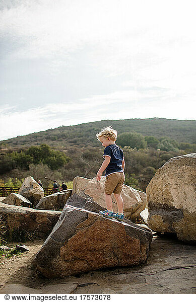 Three Year Old Standing on Rock at Mission Trails in San Diego