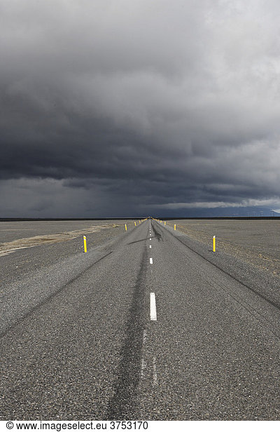 Thunderclouds forming over a highway  Skei_ararsandur glacial outwash plain  southern coast of Iceland  Atlantic Ocean