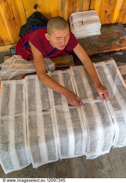 Tibetan scriptures printed from wooden blocks in the monastery traditional printing temple  Gansu province  Labrang  China.
