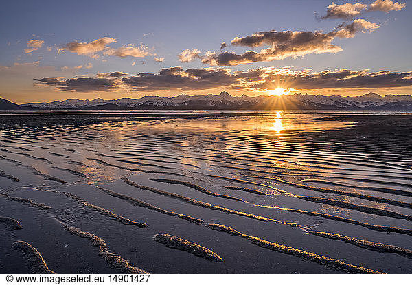 Tidal Flats at low tide at sunset with the Chilkat Mountains in the distance  Eagle Beach State Recreation Area  near Juneau; Alaska  United States of America