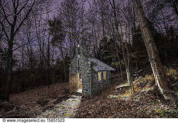Tiny church in woods during Fall near Stowe Vermont