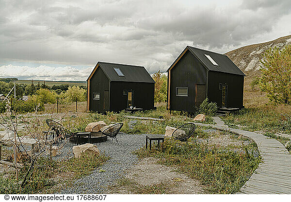 Tiny houses at rural landscape