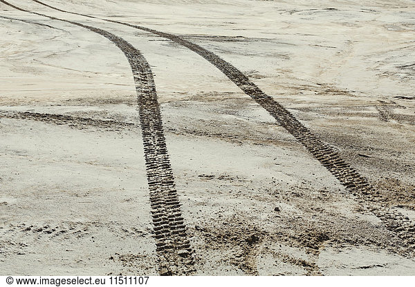 Tire tracks on the surface of the desert  parallel tracks.